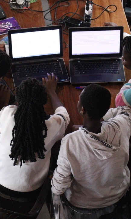 Two students using their computers.